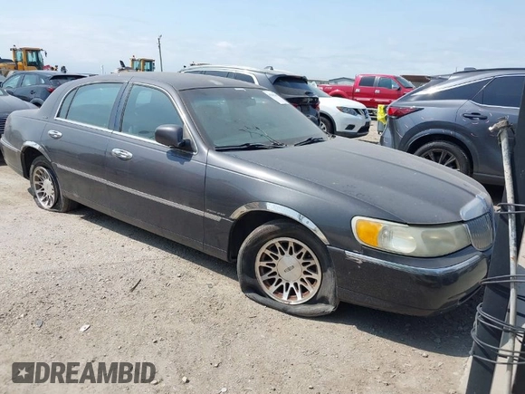 2001 Lincoln Town Car Signature z VIN 1LNHM82W11Y695417, wystawiony jako IAAI lot #42041548 z przebiegiem 117 392 mil mil oraz . Historia ofert i sprzedaży dostępna na DreamBid. Obrazek 1.