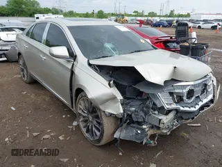 2014 Cadillac XTS Platinum z VIN 2G61T5S31E9209179, wystawiony jako IAAI lot #42241440 z przebiegiem 79 651 mil mil oraz . Historia ofert i sprzedaży dostępna na DreamBid. Obrazek 1.