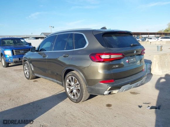 2023 BMW X5 sDrive40i with VIN 5UXCR4C02P9S02333, listed as a IAAI auction lot 41219318 with 32,966 mi miles. Bid and sale history available at carsss.com. Image 3.