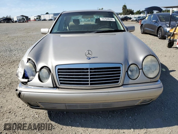 1999 Mercedes-Benz E-Class with VIN WDBJF65H5XA804902, listed as a Copart auction lot 73704634 with 92,411 mi miles and Salvage Title. Bid and sale history available at carsss.com. Image 5.