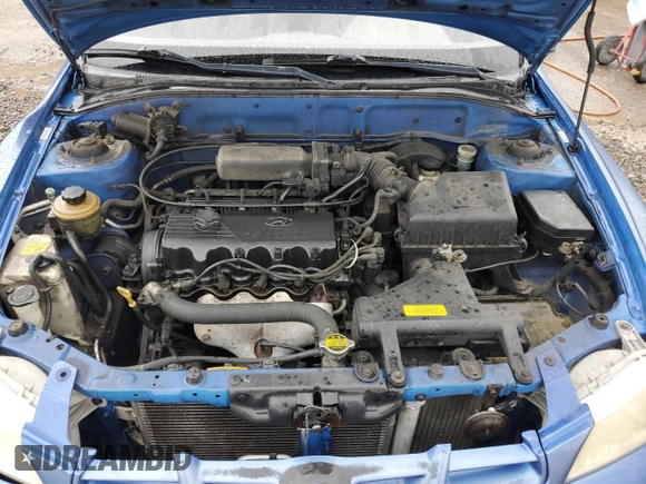 2001 Hyundai Accent z VIN KMHCF35G11U112976, wystawiony jako Copart lot #68692384 z przebiegiem 152 797 mil mil oraz Szkoda całkowita • Salvage title. Historia ofert i sprzedaży dostępna na DreamBid. Obrazek 11.