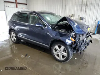 2014 Volkswagen Touareg Sport с VIN WVGEF9BP2ED002718, выставлен на аукционе Copart как лот 59526575 с пробегом 194 480 миль миль и На запчасти • Non repairable. История ставок и продаж доступна на DreamBid. Изображение 4.