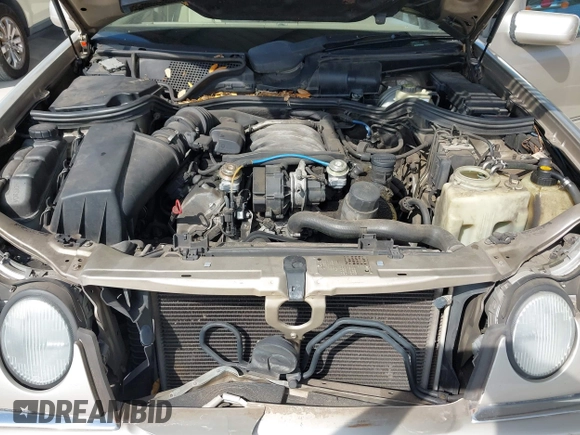 1999 Mercedes-Benz E-Class with VIN WDBJH65F3XA845635, listed as a IAAI auction lot 42102122 with 215,678 mi miles. Bid and sale history available at carsss.com. Image 10.