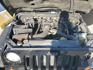 2010 Jeep Wrangler Sahara z VIN 1J4AA5D1XAL227305, wystawiony jako Copart lot #70165554 z przebiegiem Nie podano mil oraz Szkoda całkowita • Salvage title. Historia ofert i sprzedaży dostępna na DreamBid. Obrazek 12.