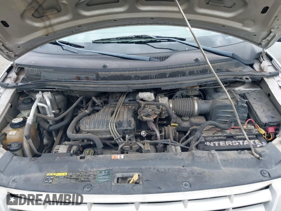 2004 Ford Freestar SE z VIN 2FMZA51664BA73569, wystawiony jako IAAI lot #39712844 z przebiegiem 182 013 mil mil oraz . Historia ofert i sprzedaży dostępna na DreamBid. Obrazek 10.
