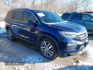 2017 Honda Pilot Touring with VIN 5FNYF6H99HB105446, listed as a IAAI auction lot 41283368 with 91,452 mi miles and . Bid and sale history available at DreamBid. Image 1.
