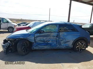2024 Hyundai Ioniq 5 SEL z VIN KM8KN4DE0RU264604, wystawiony jako IAAI lot #41669323 z przebiegiem 3 207 mil mil oraz . Historia ofert i sprzedaży dostępna na DreamBid. Obrazek 13.