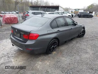 2013 BMW 3 Series 328i xDrive with VIN WBA3B3C56DF542509, listed as a IAAI auction lot 42010587 with 187,082 mi miles. Bid and sale history available at carsss.com. Image 4.