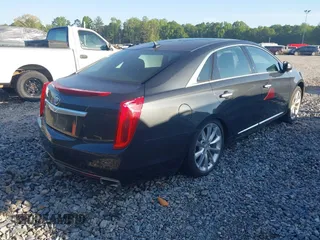 2013 Cadillac XTS Luxury with VIN 2G61P5S3XD9141306, listed as a IAAI auction lot 42034077 with 120,294 mi miles. Bid and sale history available at carsss.com. Image 4.