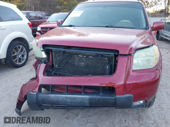2006 Honda Pilot EX-L with VIN 5FNYF28586B005602, listed as a IAAI auction lot 41247326 with 221,698 mi miles and . Bid and sale history available at DreamBid. Image 6.