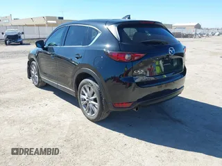 2020 Mazda CX-5 Grand Touring with VIN JM3KFBDMXL0763316, listed as a IAAI auction lot 41661958 with 64,881 mi miles and . Bid and sale history available at carsss.com. Image 3.