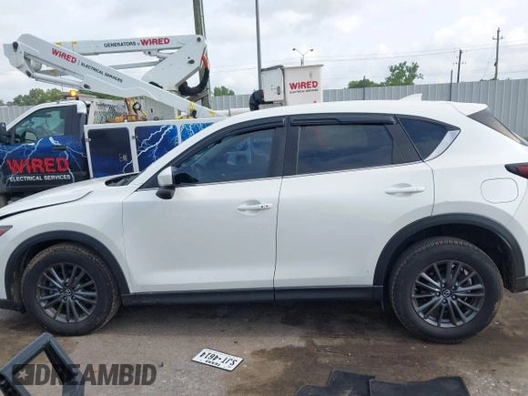 2020 Mazda CX-5 Touring z VIN JM3KFBCM2L0786784, wystawiony jako IAAI lot #42127457 z przebiegiem 62 665 mil mil oraz . Historia ofert i sprzedaży dostępna na DreamBid. Obrazek 14.