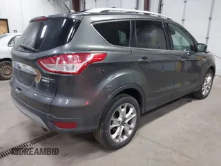 2016 Ford Escape Titanium with VIN 1FMCU9J90GUB35593, listed as a IAAI auction lot 42309020 with 173,019 mi miles and . Bid and sale history available at DreamBid. Image 4.