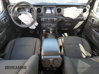 2023 Jeep Wrangler Sport with VIN 1C4HJXDNXPW701795, listed as a Copart auction lot 50451444 with 7,274 mi miles and Salvage Title. Bid and sale history available at DreamBid. Image 8.