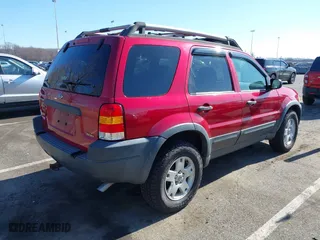2003 Ford Escape XLT Popular 2 with VIN 1FMCU93183KC65571, listed as a IAAI auction lot 41768982 with 150,658 mi miles. Bid and sale history available at carsss.com. Image 4.