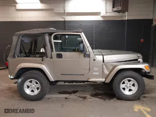 2004 Jeep Wrangler Sahara with VIN 1J4FA59S64P736389, listed as a IAAI auction lot 41432819 with 102,830 mi miles. Bid and sale history available at carsss.com. Image 13.