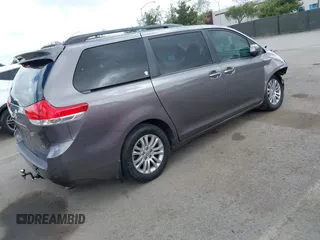 2014 Toyota Sienna XLE with VIN 5TDYK3DC7ES517206, listed as a IAAI auction lot 41945572 with 128,743 mi miles and . Bid and sale history available at DreamBid. Image 4.