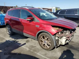 2015 Ford Escape Titanium with VIN 1FMCU9J99FUC82817, listed as a Copart auction lot 52206505 with 129,840 mi miles and Salvage Title. Bid and sale history available at carsss.com. Image 4.