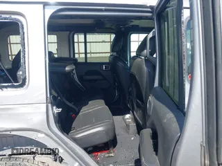 2018 Jeep Wrangler Unlimited Sahara z VIN 1C4HJXEG2JW124882, wystawiony jako IAAI lot #42437816 z przebiegiem Nie podano mil oraz . Historia ofert i sprzedaży dostępna na DreamBid. Obrazek 8.