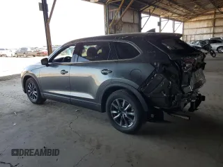 2021 Mazda CX-9 Touring z VIN JM3TCACYXM0520912, wystawiony jako Copart lot #60726695 z przebiegiem 36 506 mil mil oraz Szkoda całkowita • Salvage title. Historia ofert i sprzedaży dostępna na DreamBid. Obrazek 2.