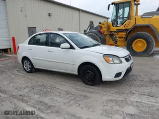 2011 Kia Rio LX with VIN KNADH4A39B6732148, listed as a IAAI auction lot 41460548 with 257,836 mi miles. Bid and sale history available at carsss.com. Image 1.
