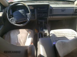 1995 Jeep Grand Cherokee Laredo with VIN 1J4FX58S1SC754691, listed as a Copart auction lot 72858214 with 251,234 mi miles and Salvage Title. Bid and sale history available at carsss.com. Image 8.