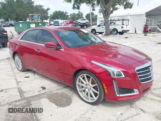 2015 Cadillac CTS Luxury AWD z VIN 1G6AX5SX2F0112852, wystawiony jako IAAI lot #42398611 z przebiegiem 70 253 mil mil oraz . Historia ofert i sprzedaży dostępna na DreamBid. Obrazek 1.