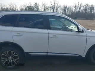 2016 Mitsubishi Outlander GT z VIN JA4JZ4AXXGZ010676, wystawiony jako IAAI lot #41527681 z przebiegiem 71 866 mil mil oraz . Historia ofert i sprzedaży dostępna na DreamBid. Obrazek 13.