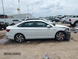 2021 Volkswagen Jetta S z VIN 3VW6T7BU2MM061165, wystawiony jako IAAI lot #42423828 z przebiegiem 41 603 mil mil oraz . Historia ofert i sprzedaży dostępna na DreamBid. Obrazek 13.