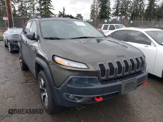 2015 Jeep Cherokee Trailhawk with VIN 1C4PJMBB5FW510514, listed as a IAAI auction lot 41492111 with 98,482 mi miles and . Bid and sale history available at DreamBid. Image 1.