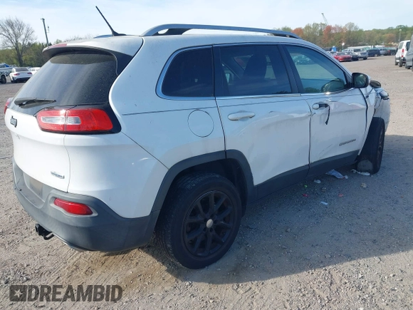 2015 Jeep Cherokee Latitude with VIN 1C4PJLCS6FW689607, listed as a IAAI auction lot 42103286 with 142,479 mi miles. Bid and sale history available at carsss.com. Image 4.