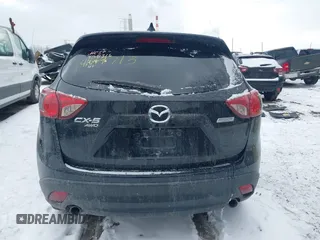 2014 Mazda CX-5 Touring with VIN JM3KE4CY8E0416590, listed as a IAAI auction lot 41619713 with 225,156 mi miles. Bid and sale history available at carsss.com. Image 17.