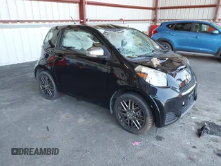 2012 Scion iQ with VIN JTNJJXB00CJ016247, listed as a IAAI auction lot 42117563 with 105,809 mi miles. Bid and sale history available at carsss.com. Image 1.