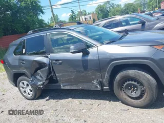 2019 Toyota RAV4 LE with VIN JTMG1RFV9KD014526, listed as a IAAI auction lot 42638858 with 90,995 mi miles and . Bid and sale history available at DreamBid. Image 14.