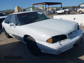 1999 Pontiac Bonneville SE z VIN 1G2HX52KXXH254051, wystawiony jako IAAI lot #41990245 z przebiegiem 213 000 mil mil oraz . Historia ofert i sprzedaży dostępna na DreamBid. Obrazek 1.