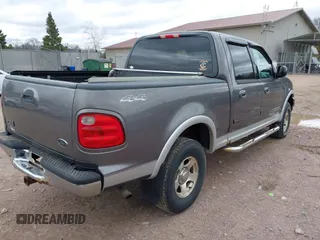 2002 Ford F-150 XLT with VIN 1FTRW08612KB42637, listed as a IAAI auction lot 42036615 with 178,548 mi miles. Bid and sale history available at carsss.com. Image 4.