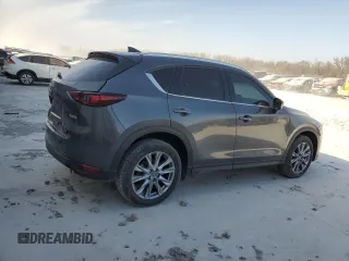 2021 Mazda CX-5 Grand Touring with VIN JM3KFBDM0M1464817, listed as a Copart auction lot 48821965 with 53,648 mi miles and Clean Title. Bid and sale history available at carsss.com. Image 3.