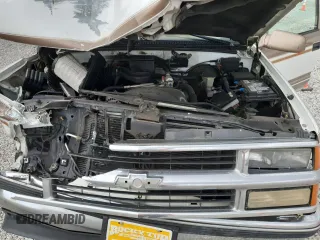 1999 Chevrolet Suburban with VIN 3GNEC16R9XG143471, listed as a Copart auction lot 53856565 with 208,621 mi miles and Salvage title. Bid and sale history available at DreamBid. Image 12.