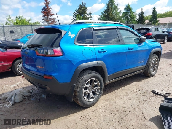 2020 Jeep Cherokee Trailhawk with VIN 1C4PJMBXXLD636547, listed as a IAAI auction lot 42314654 with 59,061 mi miles and . Bid and sale history available at DreamBid. Image 4.