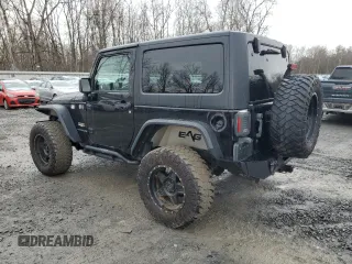 2014 Jeep Wrangler Sahara with VIN 1C4AJWBG0EL306703, listed as a Copart auction lot 51450215 with 115,932 mi miles and Salvage Title. Bid and sale history available at DreamBid. Image 2.
