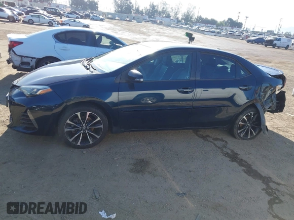2019 Toyota Corolla L with VIN 5YFBURHE7KP922064, listed as a IAAI auction lot 41977741 with 54,896 mi miles and . Bid and sale history available at DreamBid. Image 14.