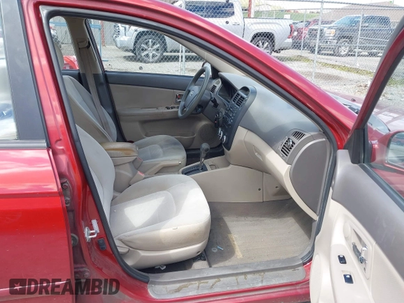 2009 Kia Spectra EX with VIN KNAFE221495665378, listed as a IAAI auction lot 42036945 with 153,254 mi miles. Bid and sale history available at carsss.com. Image 5.