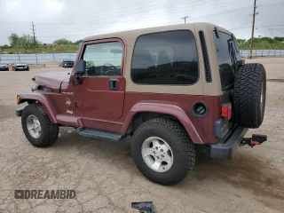 2002 Jeep Wrangler Sahara with VIN 1J4FA59S32P746410, listed as a Copart auction lot 56403075 with 147,968 mi miles and Salvage title. Bid and sale history available at DreamBid. Image 2.