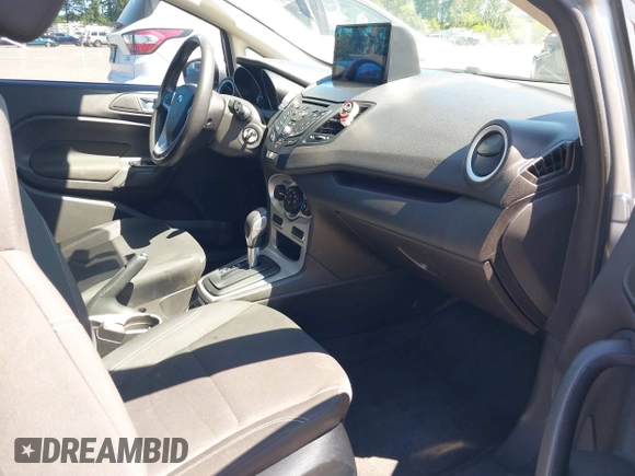 2016 Ford Fiesta SE z VIN 3FADP4EJ0GM122392, wystawiony jako IAAI lot #42364419 z przebiegiem 98 357 mil mil oraz . Historia ofert i sprzedaży dostępna na DreamBid. Obrazek 5.