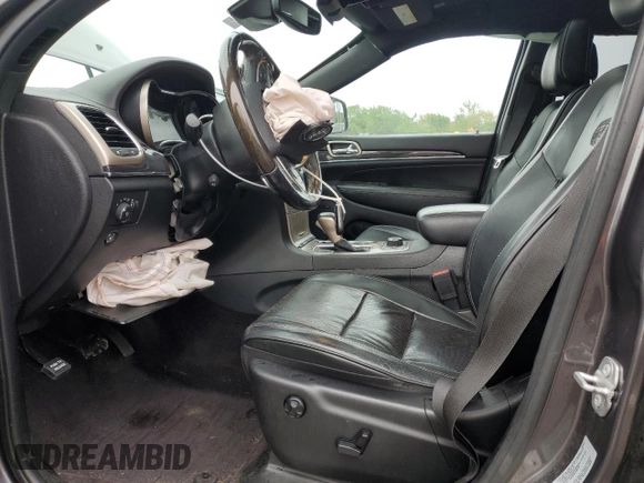 2017 Jeep Grand Cherokee Overland with VIN 1C4RJFCG8HC607872, listed as a Copart auction lot 57493195 with 164,478 mi miles and Salvage title. Bid and sale history available at DreamBid. Image 7.
