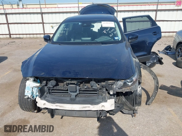 2020 Mazda CX-9 Touring with VIN JM3TCACY1L0419630, listed as a IAAI auction lot 42282675 with 105,207 mi miles and . Bid and sale history available at DreamBid. Image 13.