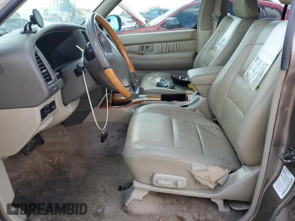 2001 Infiniti QX4 z VIN JNRDR09X61W204050, wystawiony jako Copart lot #78048074 z przebiegiem Nie podano mil oraz Szkody całkowita. Historia ofert i sprzedaży dostępna na DreamBid. Obrazek 7.