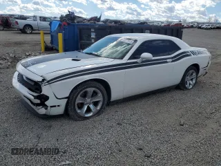 2012 Dodge Challenger SXT Plus with VIN 2C3CDYAG7CH128168, listed as a Copart auction lot 47273945 with 196,025 mi miles and Salvage Title. Bid and sale history available at carsss.com. Image 1.