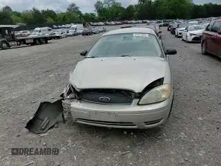 2006 Ford Taurus SE z VIN 1FAFP53U56A151555, wystawiony jako Copart lot #55227665 z przebiegiem 146 109 mil mil oraz Szkoda całkowita • Salvage title. Historia ofert i sprzedaży dostępna na DreamBid. Obrazek 13.