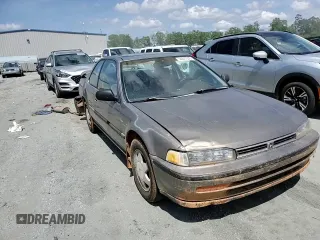 1992 Honda Accord z VIN 1HGCB7277NA019206, wystawiony jako Copart lot #54077035 z przebiegiem 227 766 mil mil oraz Szkoda całkowita • Salvage title. Historia ofert i sprzedaży dostępna na DreamBid. Obrazek 13.